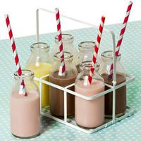 6 school milk bottles in crate with red striped paper straws