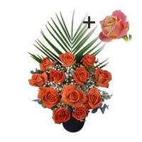 A single Peach Rose surrounded by 11 Orange Roses