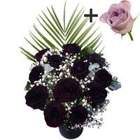 a single lilac rose surrounded by 11 black roses