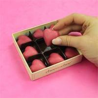 a box of pink chocolate hearts