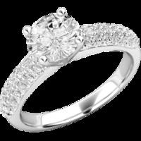 A beautiful Round Brilliant Cut diamond ring with shoulder stones in platinum (In stock)