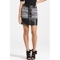 a black faux leather and aztec print skirt