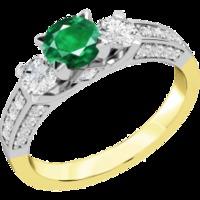 A luxurious emerald & diamond ring with shoulder stones in 18ct yellow & white gold