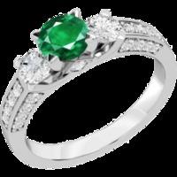 A luxurious emerald & diamond ring with shoulder stones in 18ct white gold