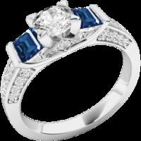 A stunning Round Brilliant Cut diamond and Sapphire ring with shoulder stones in 18ct white gold
