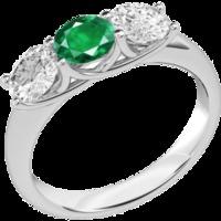 A classic three stone emerald & diamond ring in 18ct white gold