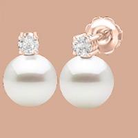 A timeless pair of White Pearl and Round Brilliant Cut diamond earrings in 18ct rose gold