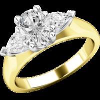 A stylish Oval Cut diamond ring with Pear shoulder stones in 18ct yellow & white gold