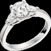 A beautiful Round Brilliant Cut diamond ring with Pear shoulder stones in platinum