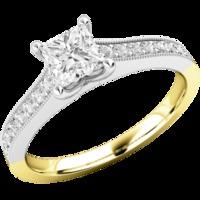 A beautiful Princess Cut diamond ring with shoulder stones in 18ct yellow & white gold