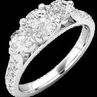 A classic Round Brilliant Cut three stone diamond ring with shoulder stones in platinum