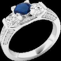 A stunning Round Cut sapphire & diamond ring with shoulder stones in platinum