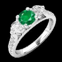 A luxurious emerald & diamond ring with shoulder stones in 18ct white gold