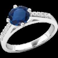 A beautiful round cut Sapphire and diamond ring with shoulder stones in 18ct white gold