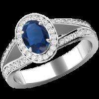 A beautiful Sapphire & diamond cluster style ring with shoulder stones in 18ct white gold
