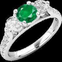 A luxurious emerald & diamond ring with shoulder stones in 18ct white gold