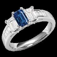 A breathtaking Emerald Cut Sapphire and Diamond three stone ring with shoulders in platinum