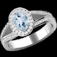 A beautiful Aqua & diamond cluster style ring with shoulder stones in 18ct white gold