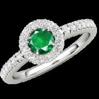 A stunning round cut Emerald and diamond ring with shoulder stones in palladium