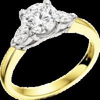 A beautiful Round Brilliant Cut diamond ring with Pear shoulder stones in 18ct yellow & white gold