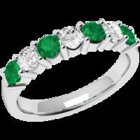 A beautiful emerald & diamond eternity ring in 18ct white gold