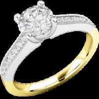 A beautiful Round Brilliant Cut diamond ring with shoulder stones in 18ct yellow & white gold