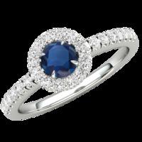 A stunning Round Cut Sapphire and diamond ring with shoulder stones in palladium