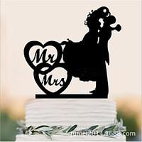 acrylic bride and grooms wedding cake is decorated with cake and caket ...