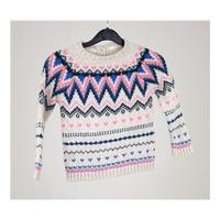 Age 4-5 years: cream multi-coloured zig-zag jumper