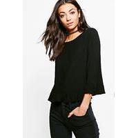 alena ruffle front top black