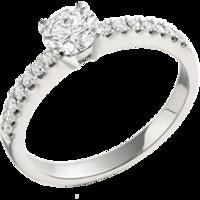 An exquisite solitaire diamond ring with shoulder stones in 18ct white gold