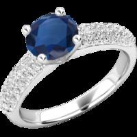 an elegant round cut sapphire and diamond ring with shoulder stones in ...