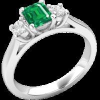 An elegant three stone emerald & diamond ring in 18ct white gold