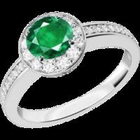 An elegant emerald & diamond cluster style ring in 18ct white gold