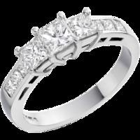 An elegant Princess Cut three stone diamond ring with shoulder stones in 18ct white gold