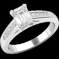 An elegant Emerald Cut diamond ring with shoulder stones in platinum