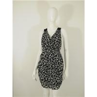 ASOS animal print mini dress with a cross straps at the back size 10