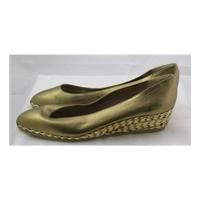 Bally, size 6.5/39.5 gold wedge heeled pumps