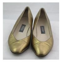 Bally, size 4.5 gold leather slip on shoes