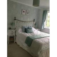 Beautiful bedroom with tv and mirrored wardrobes available to rent in large four bedroom house from