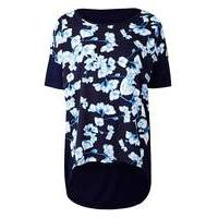 blue floral dip back woven front top