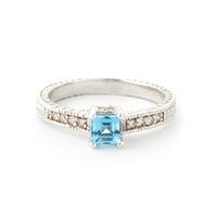 blue topaz and diamond shoulder set ring 05ct in 9ct white gold