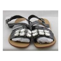 BNWT Limited Edition, size 7 black & silver distressed effect sandals