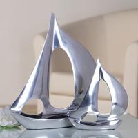 boot tall sculpture in polished aluminium