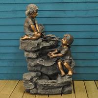 boy girl rock fountain outdoor water feature mains by kingfisher