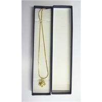 boxed gold coloured necklace