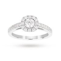 Brilliant cut 0.65 total carat weight diamond halo ring with diamond set shoulders in 18 carat white gold