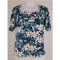 CC medium blue top with ivory and turquoise leaf design