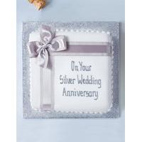 celebration chocolate cake with silver ribbon