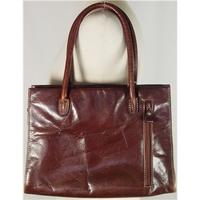 clever carriage medium brown leather handbag